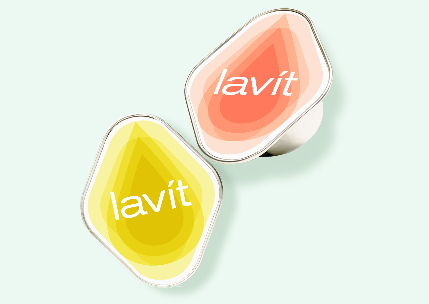 Two Lavit portable beverage pods with colorful gradient labels, one yellow and one pink, placed on a light background.
